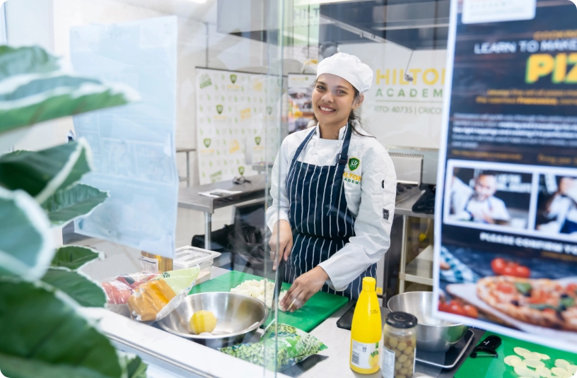 1.2.3_HILTON_FEMALE_STUDENT_KITCHEN_Certificate_III_in_Commercial_Cookery_Hospitality_Chef_VET_course_Melbourne_Hilton_Academy_Qualification